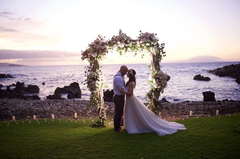 glowing wedding arch at sunset