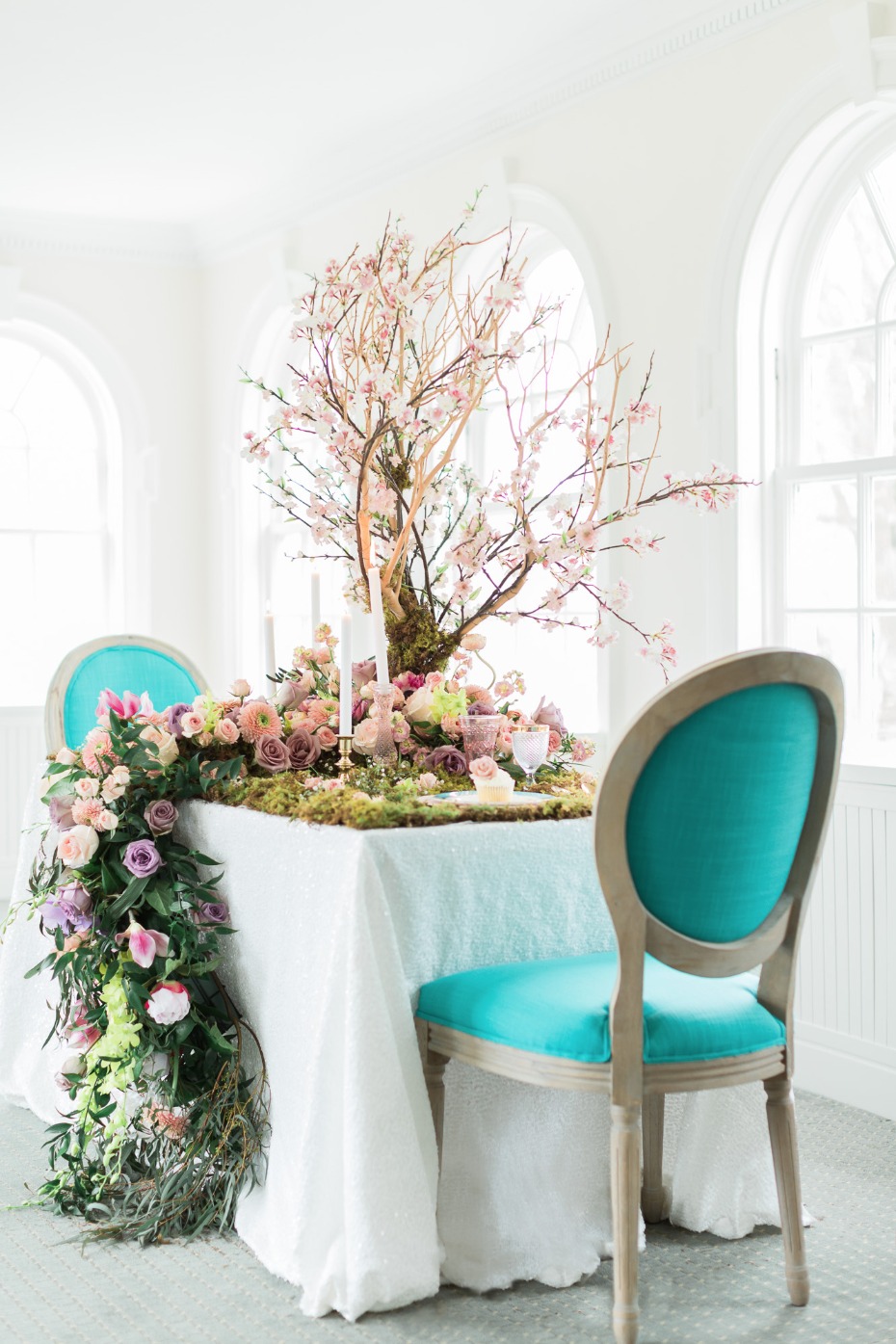 Teal chairs for this garden table setting