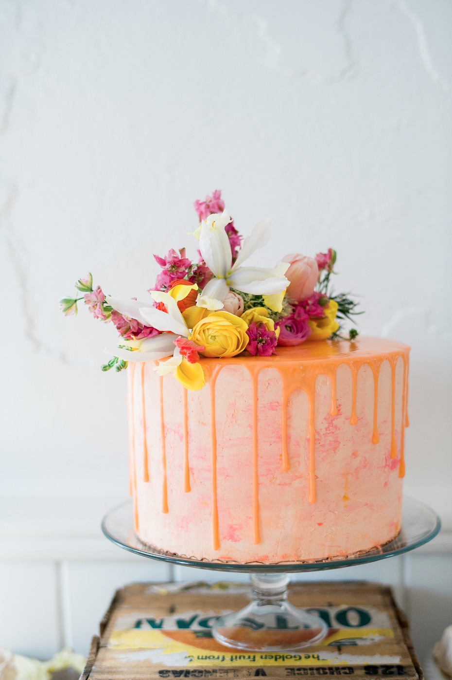 Cheerful orange and pink drip cake