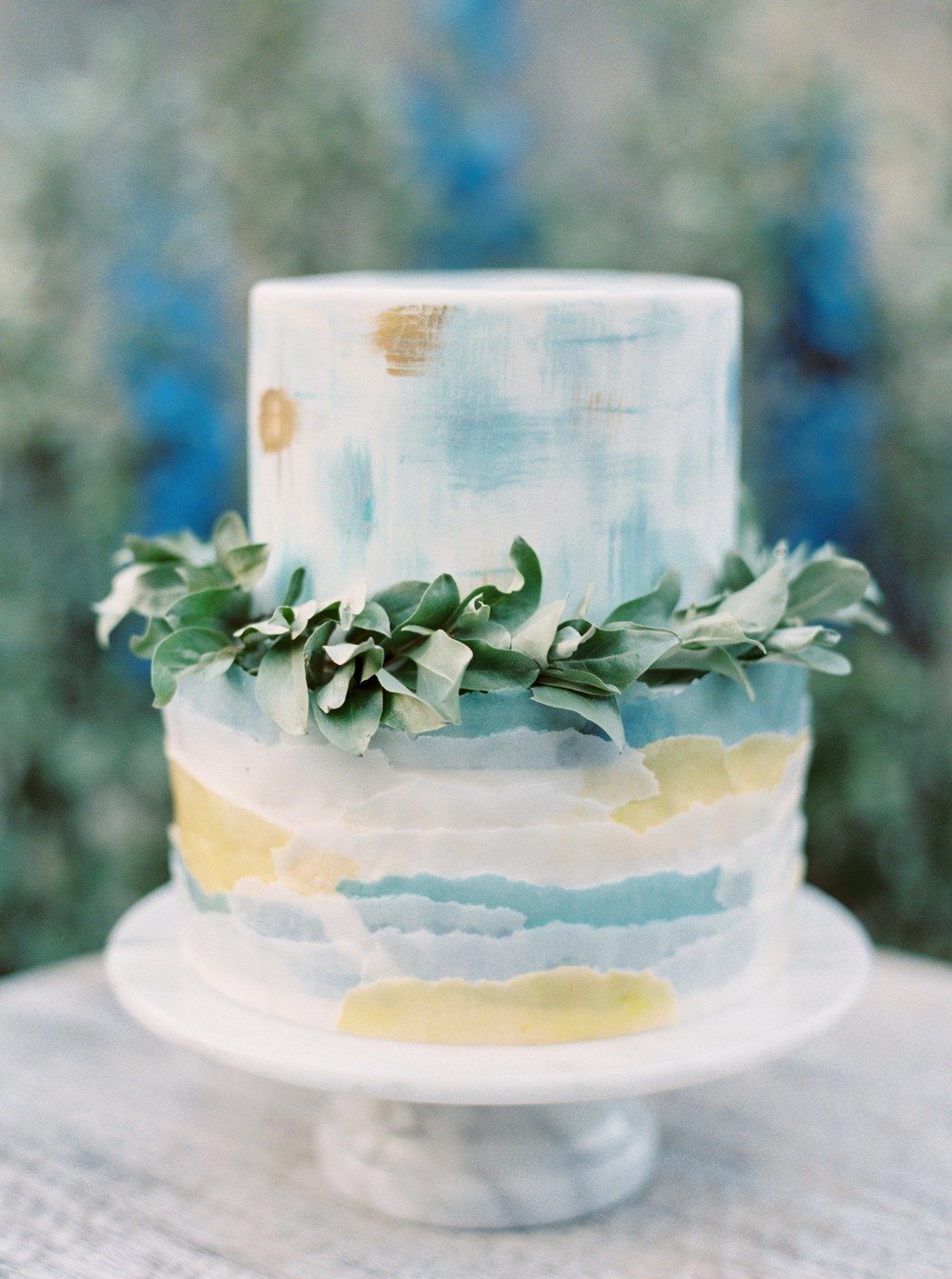 gold and blue watercolor wedding cake
