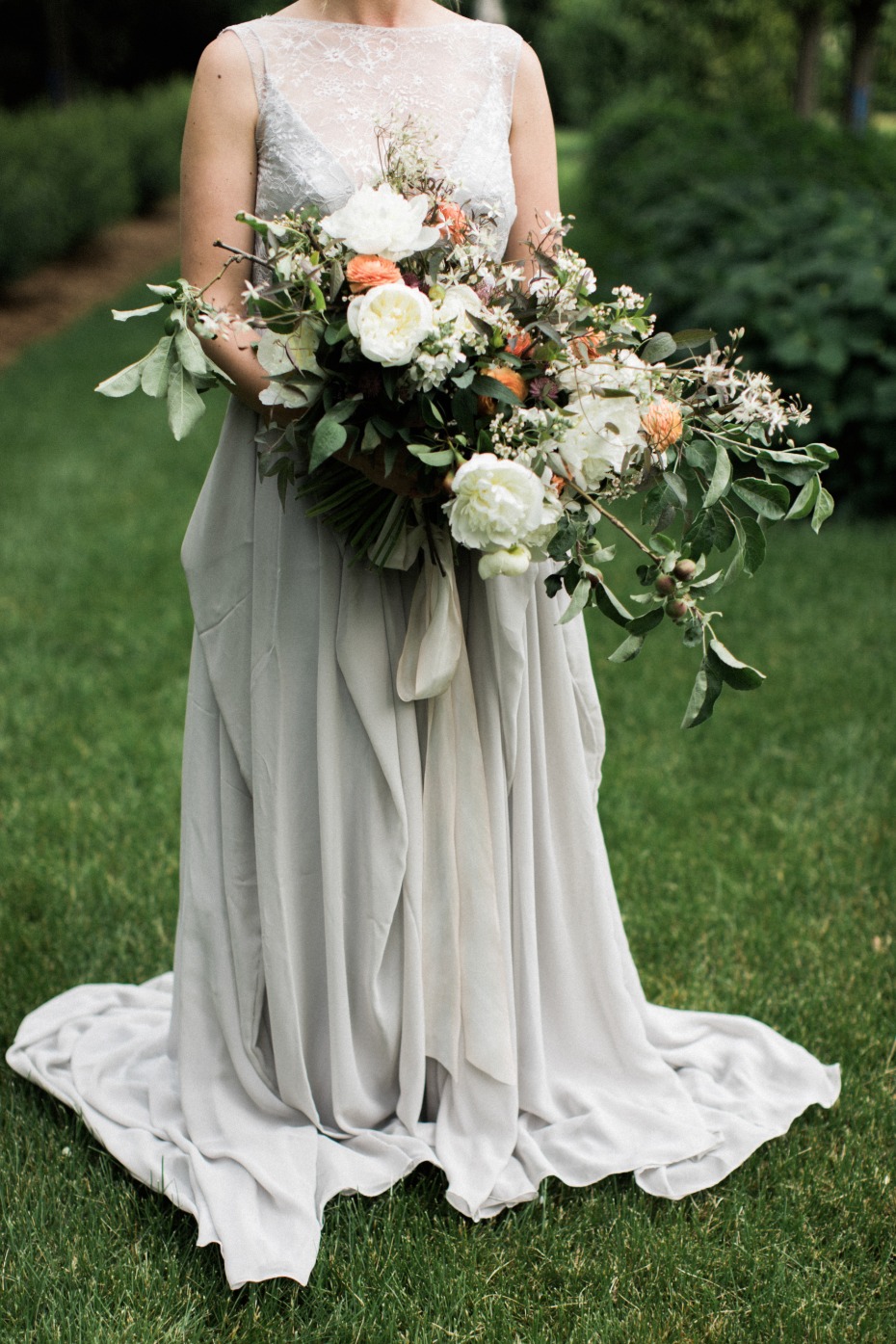 organic wedding bouuet paired with a dove grey wedding dress
