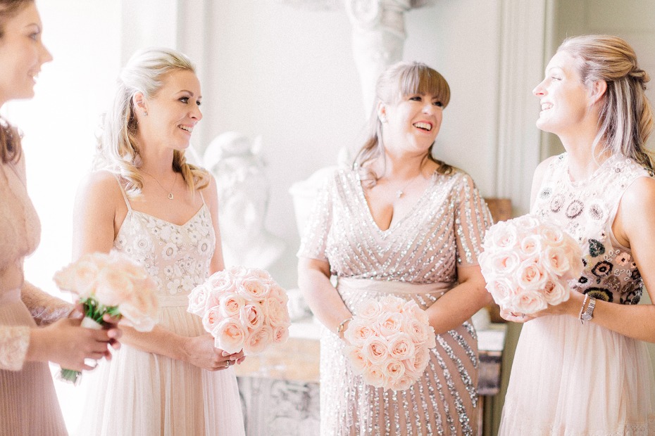 Bridesmaids in mix and match blush dresses