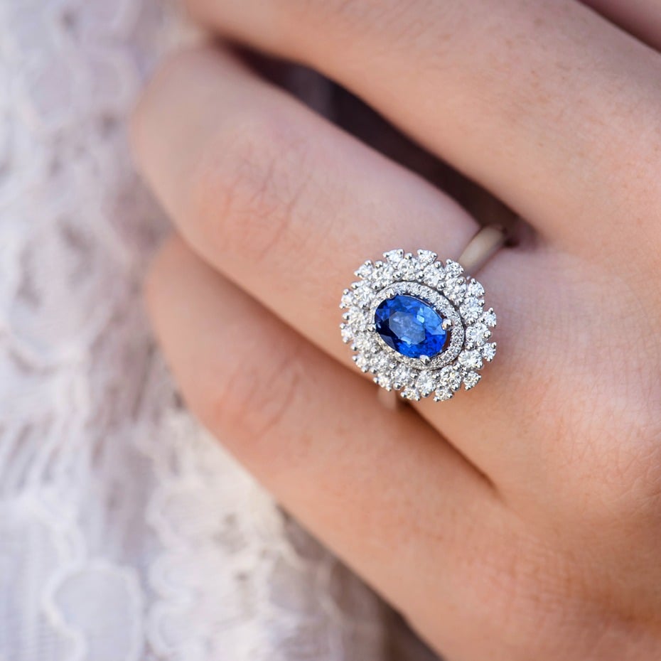 halo engagement ring with blue sapphire center