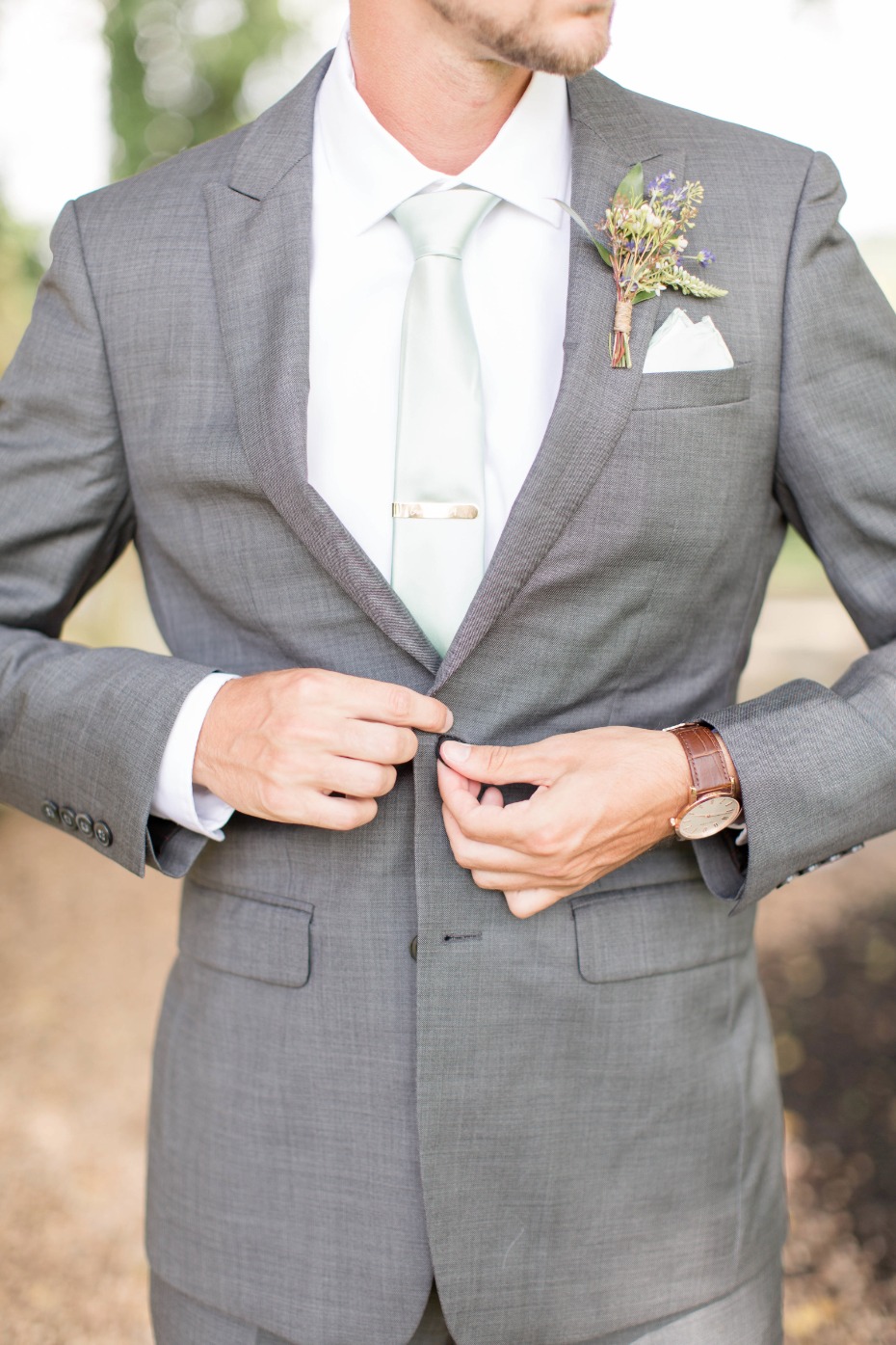 gray and mint groom look