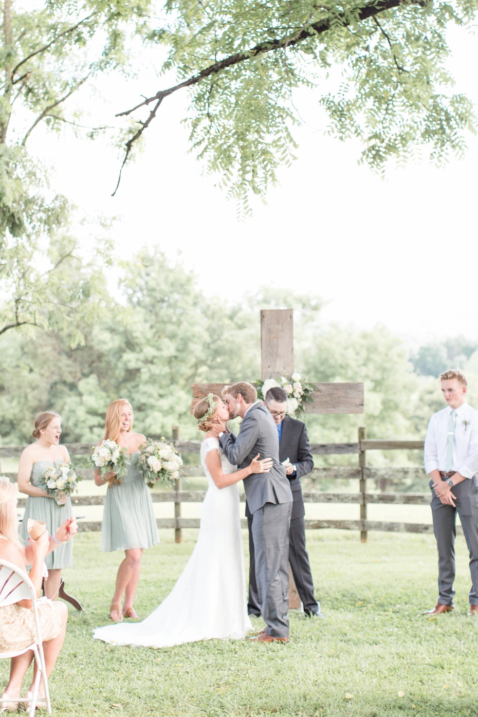 Wedding ceremony idea - get married under a tree in front of a wooden cross