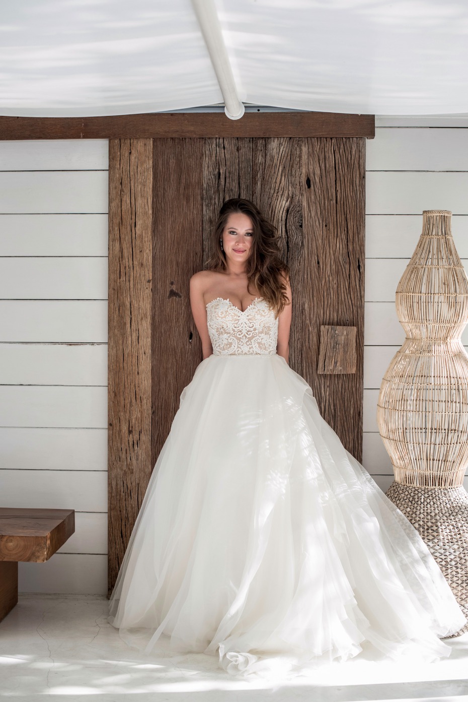 Bride in lace bodice ballgown wedding dress outdoors