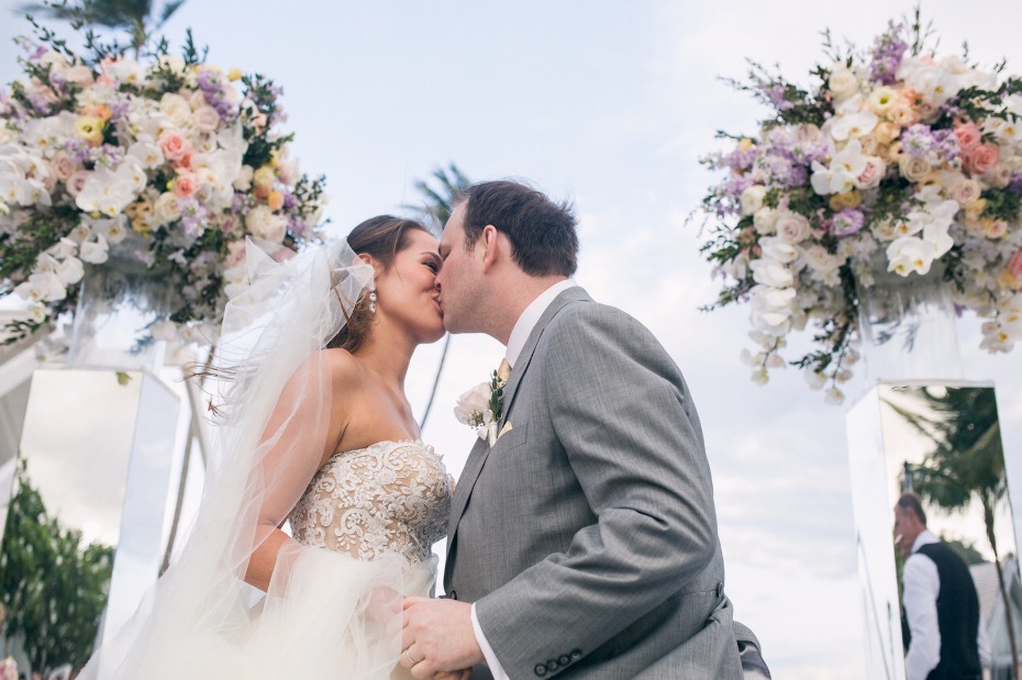 Newlyweds sharing a kiss at their beautiful wedding