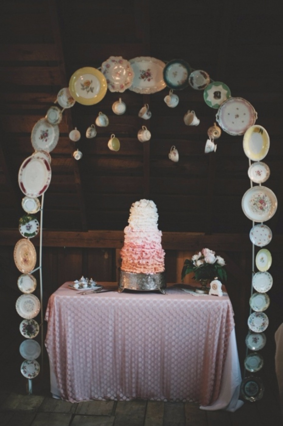 whimsical tea cup and saucer cake table arch
