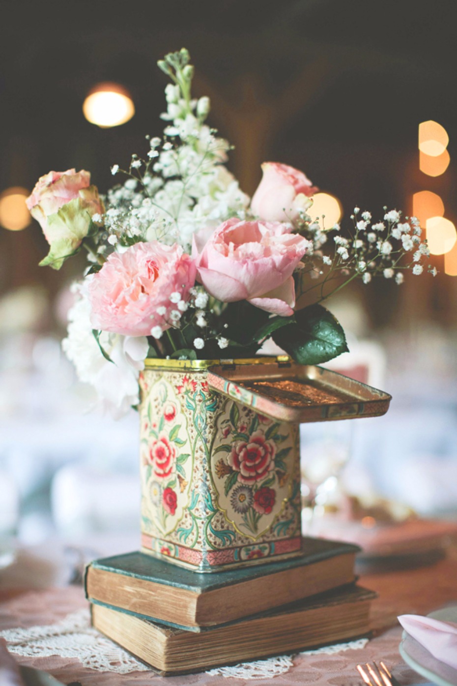 vintage books and old tin flower arrangement
