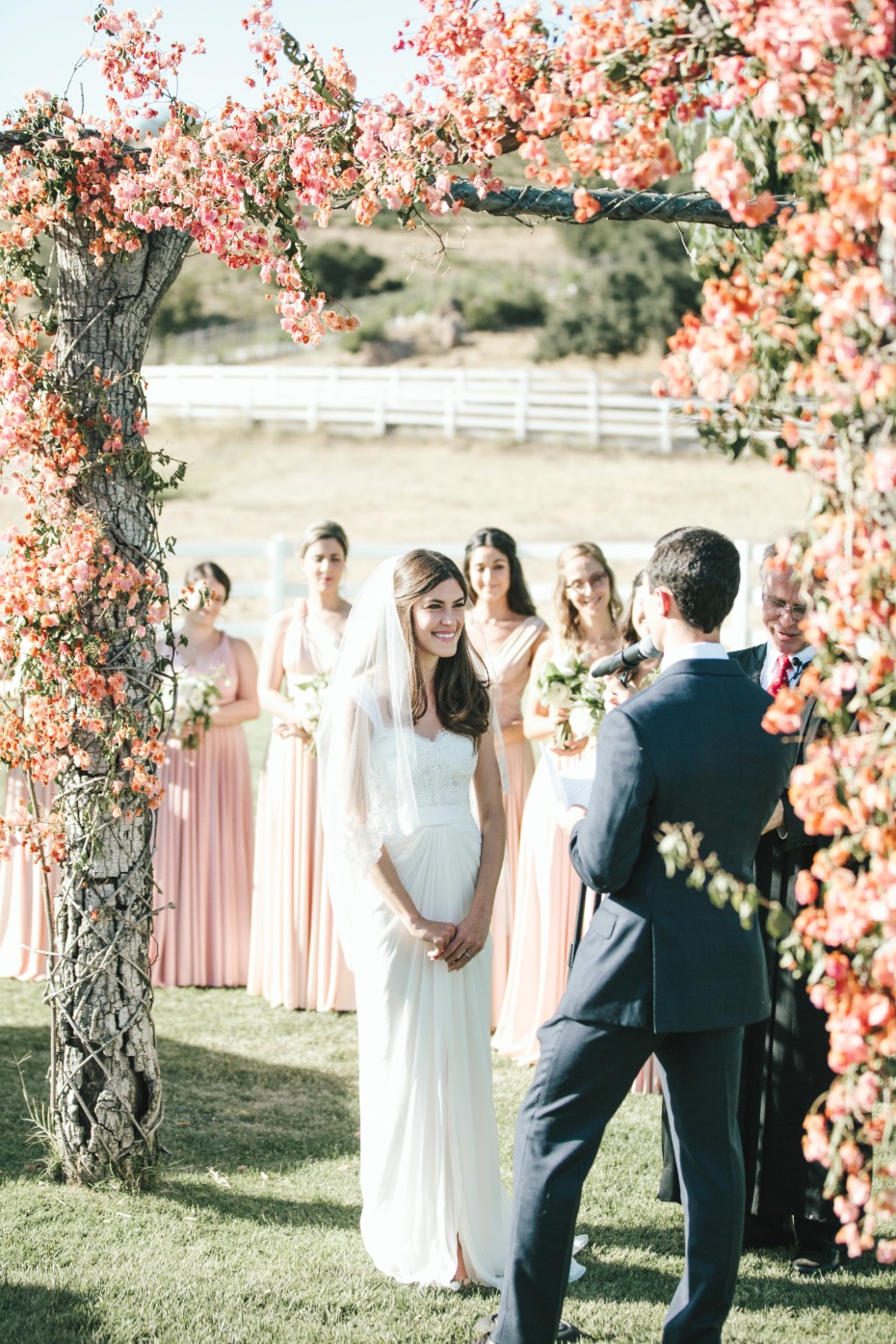 pink and peach floral wedding arch