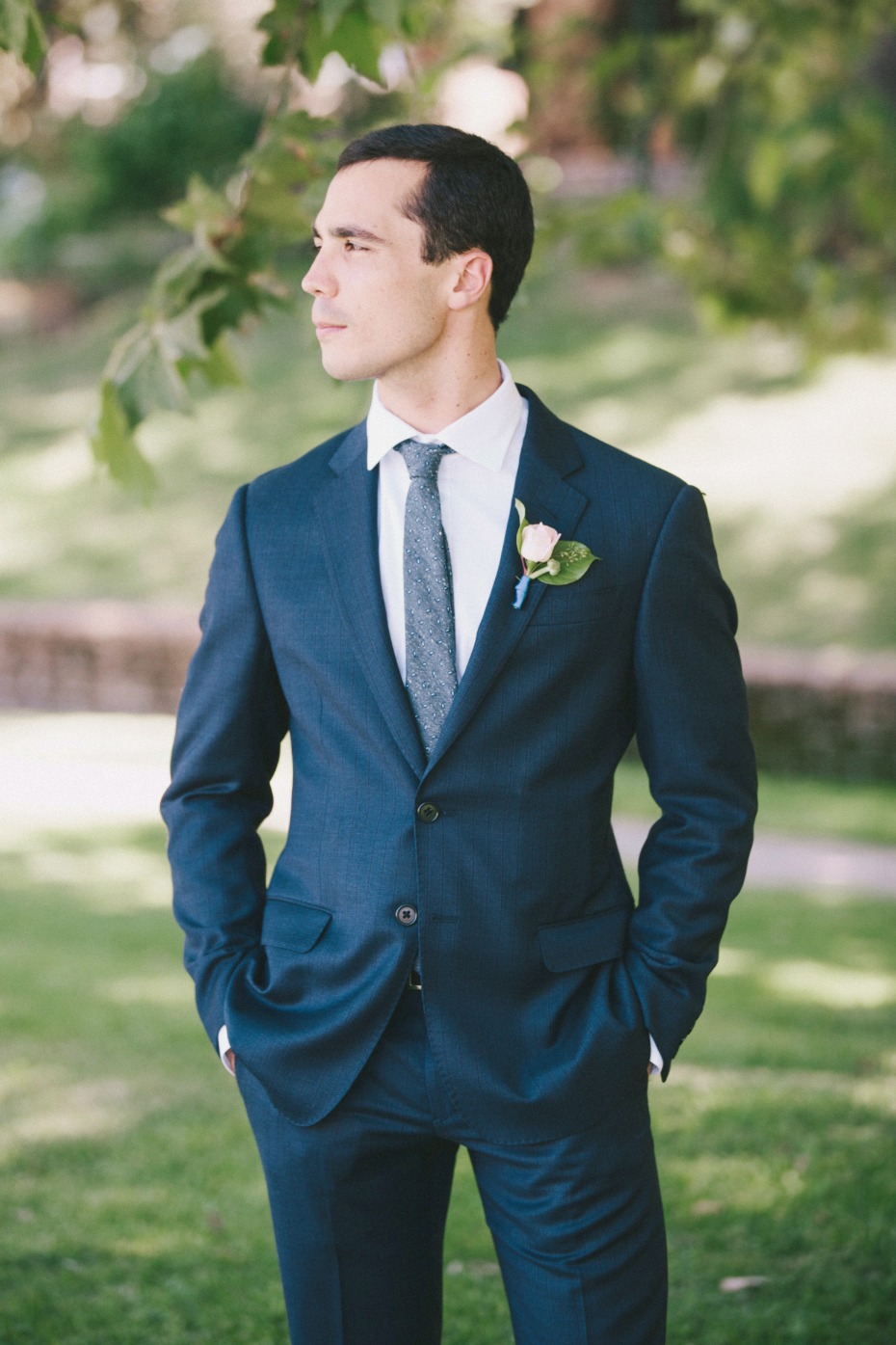 groom in classic navy wedding suit