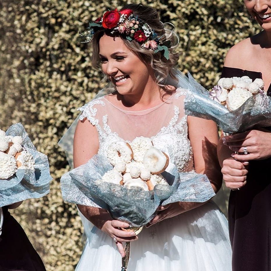 bride with donut bouquet
