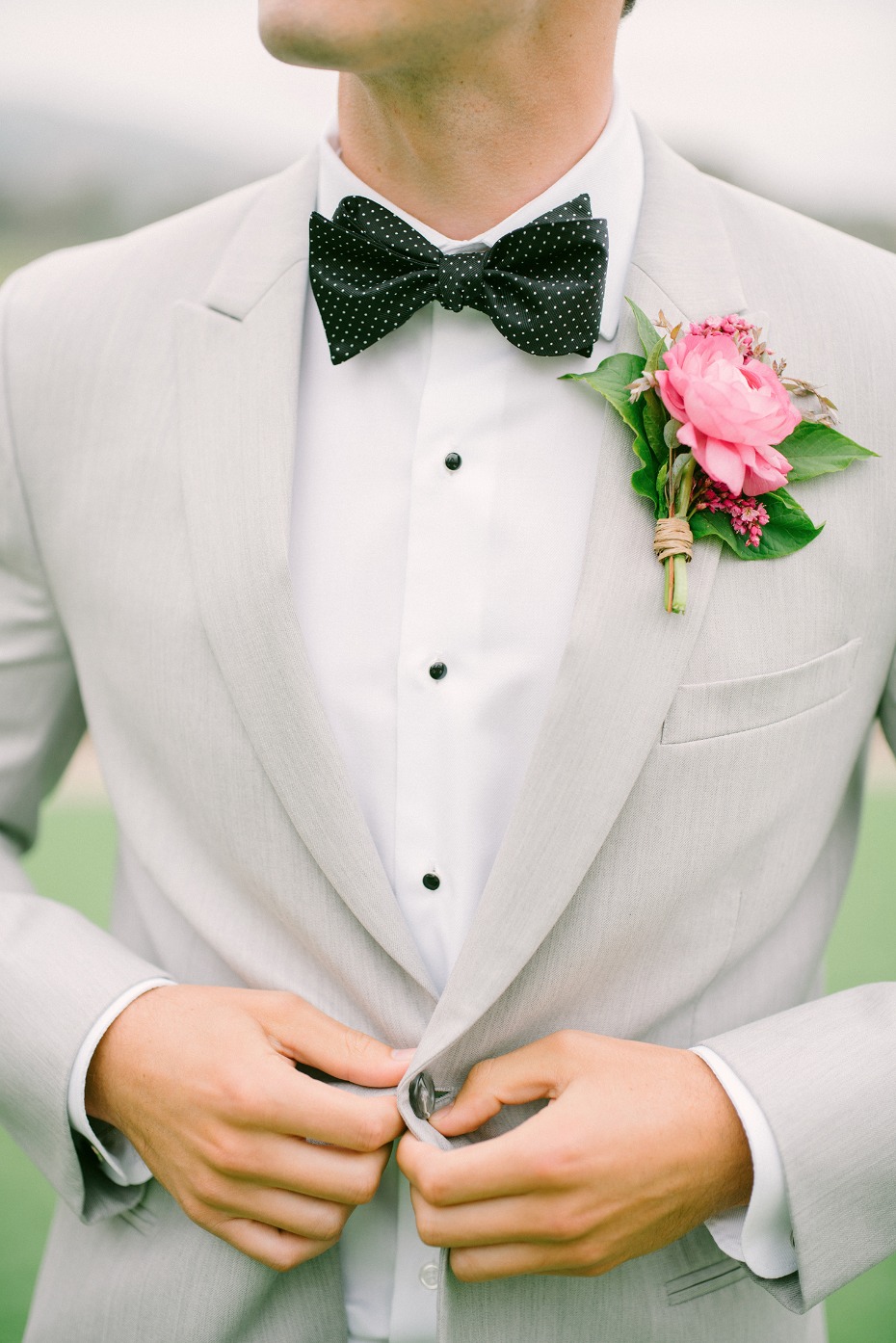 groom in grey white and blac