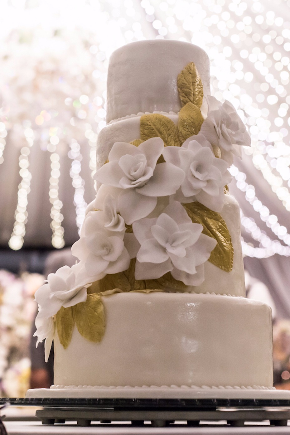 Gold and white sugar flower cake