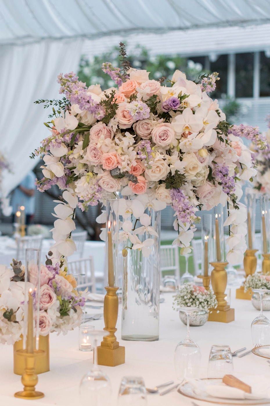 Elegant wedding centerpiece with pastel roses and orchids