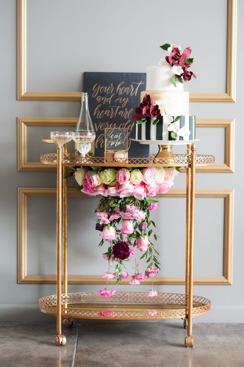 CAKE bar cart with a floral chandelier!