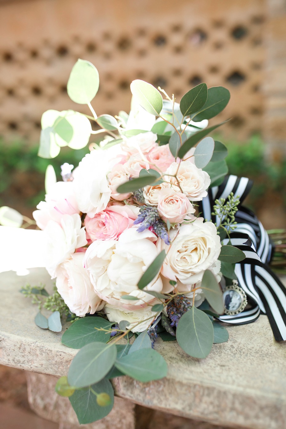 blush bouquet with striped ribbon