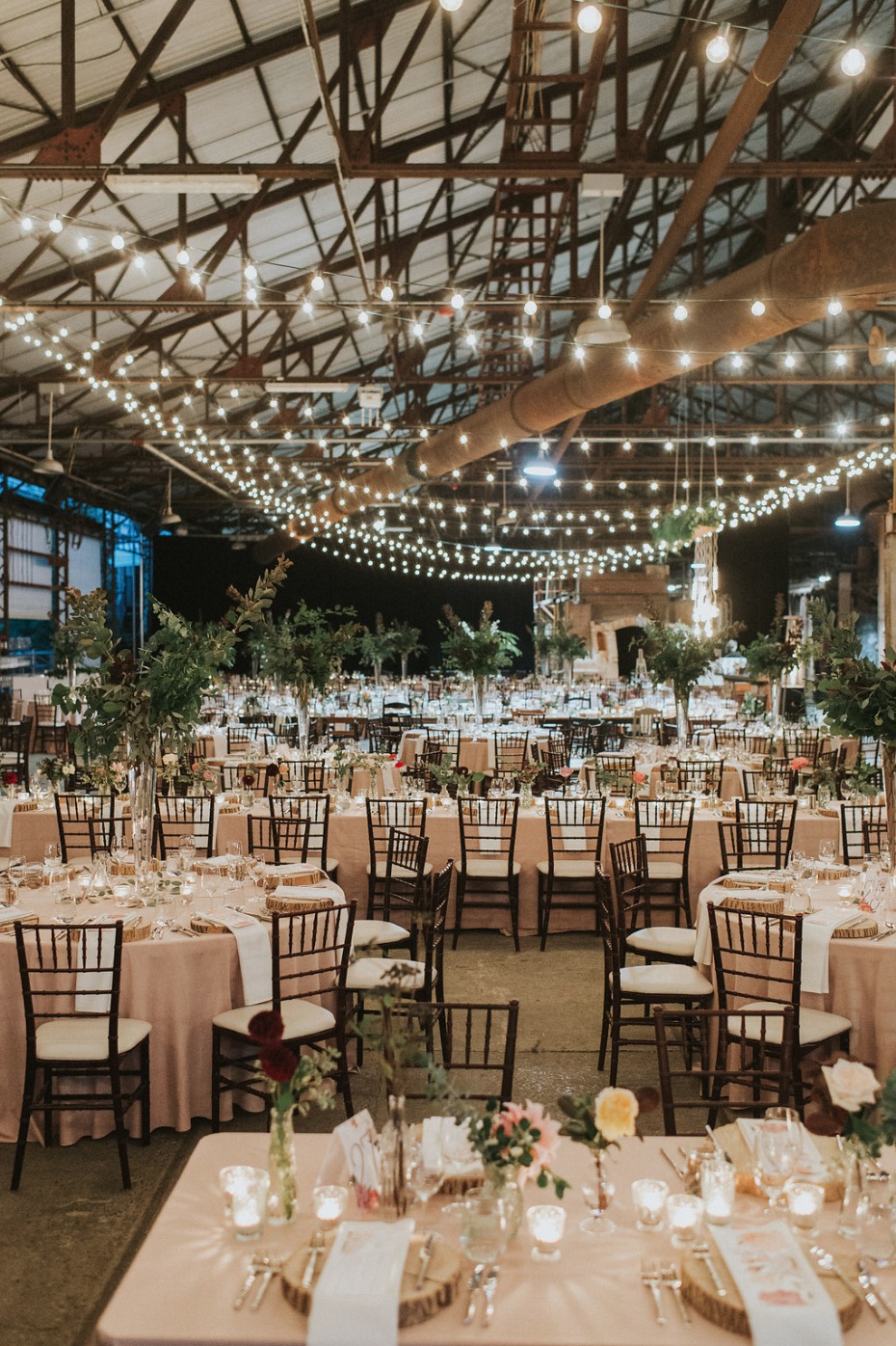 huge and intimate wedding reception with tons of string lights