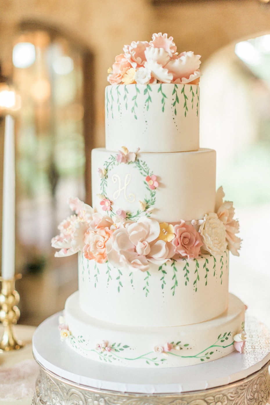 blush flower topped wedding cake