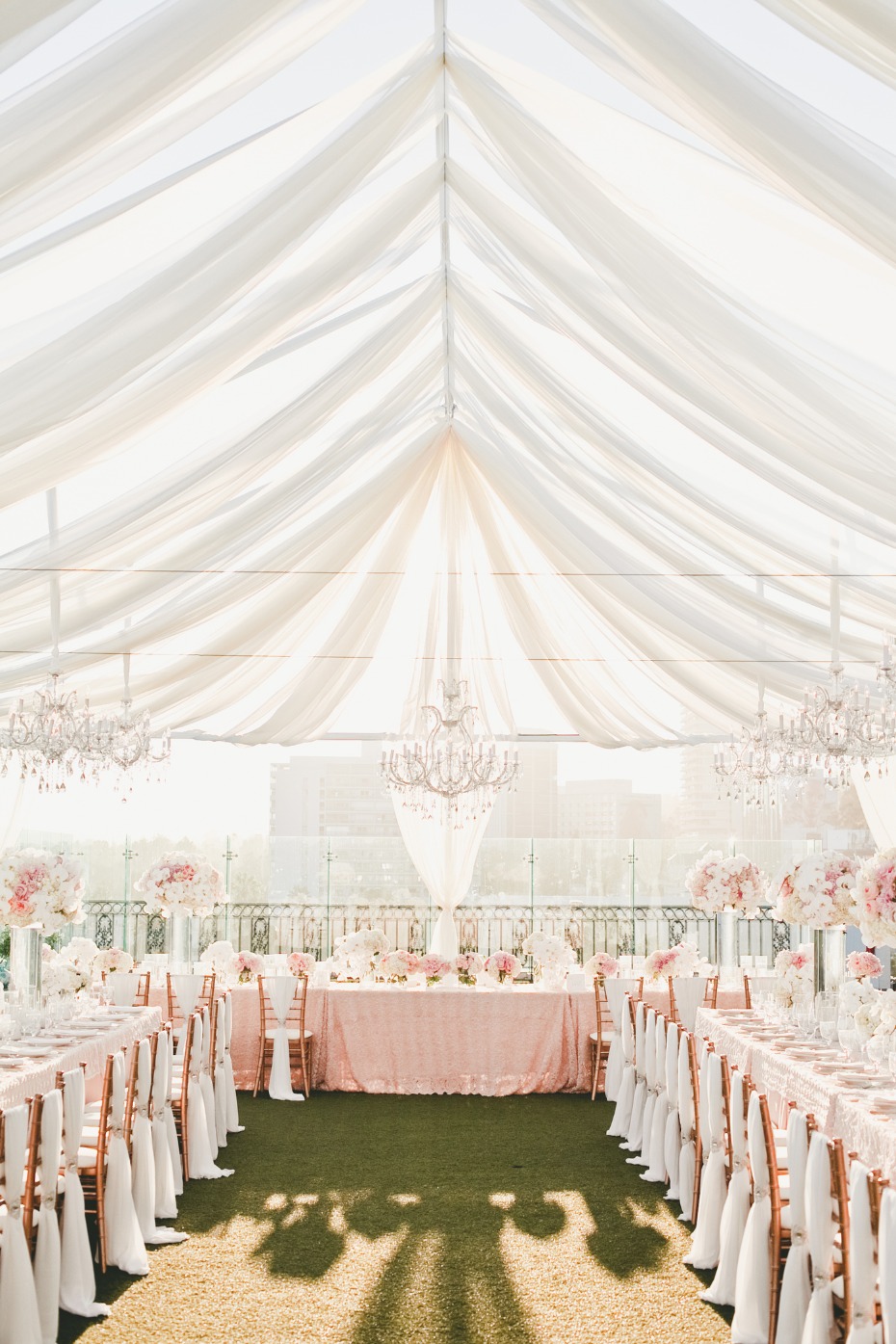 Dreamy tent reception in pink and gold from Onelove Photography
