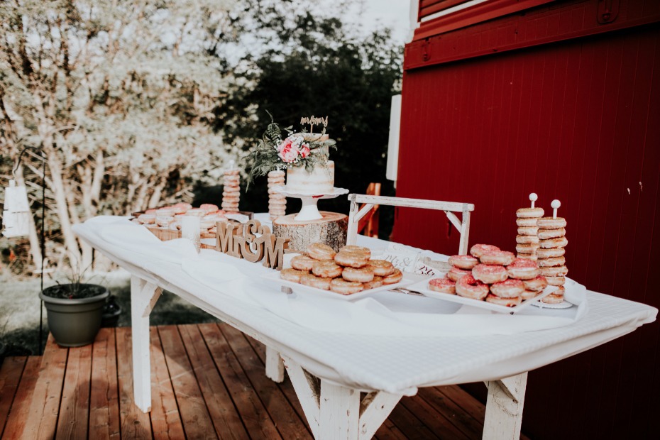 dessert table with cake and donuts