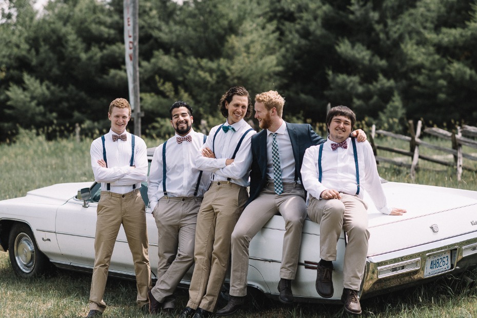 groom and his groomsmen in khakis and suspenders