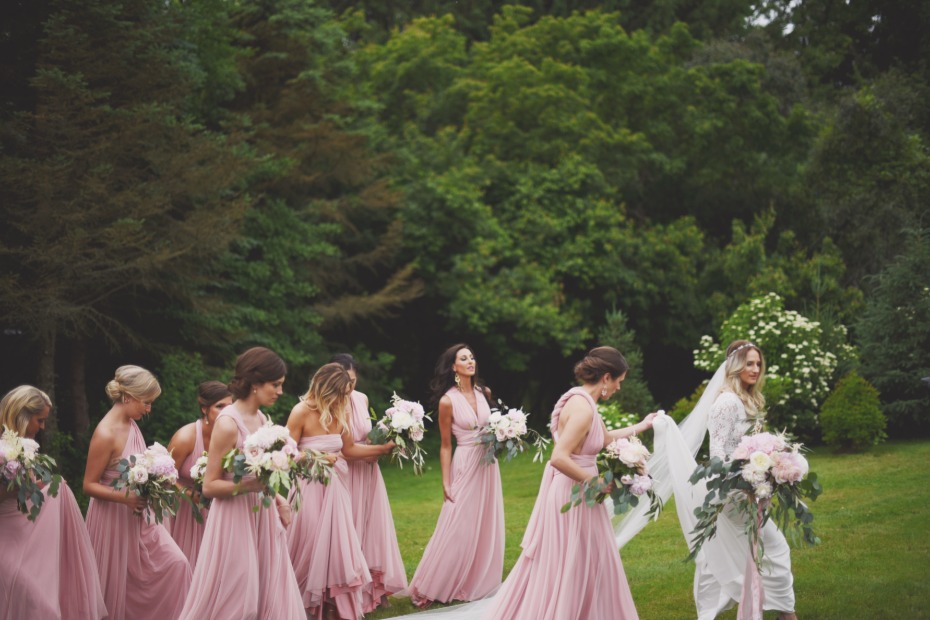 Bridesmaids in blush wrap dresses from Twobird