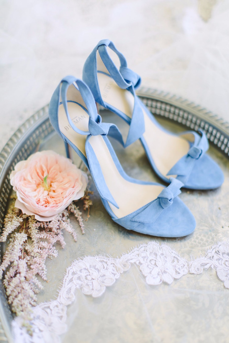 Elegant light blue high heel wedding shoes with a rose
