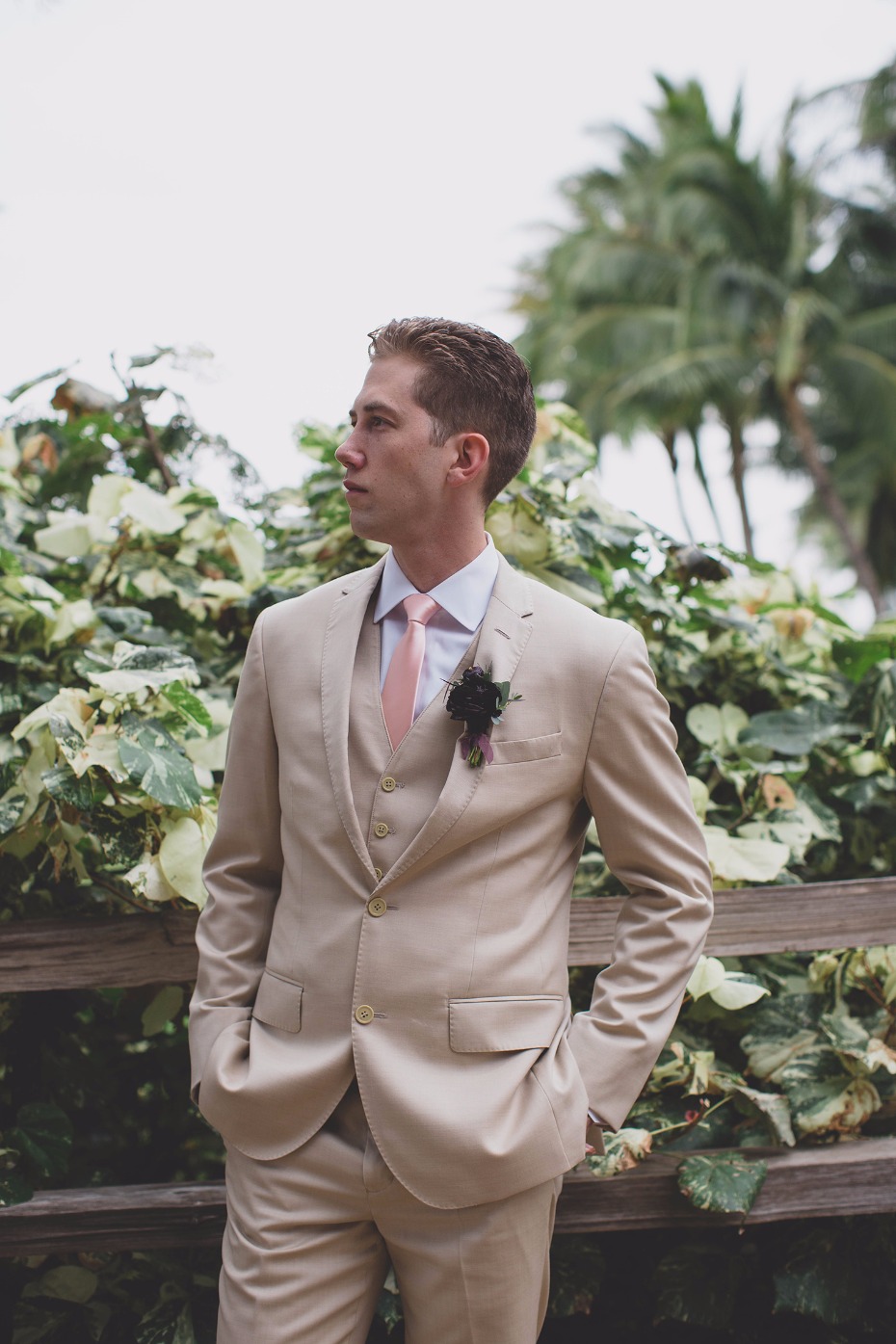 Tan suit and pink tie