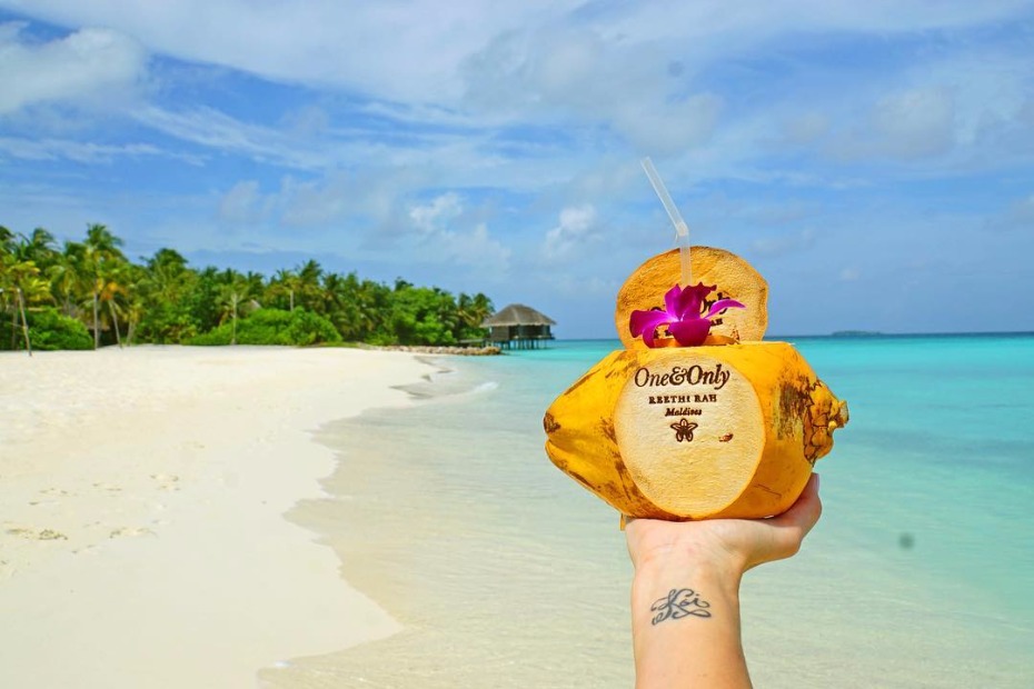 Coconut drink at One and Only Reethi Rah Maldives beach