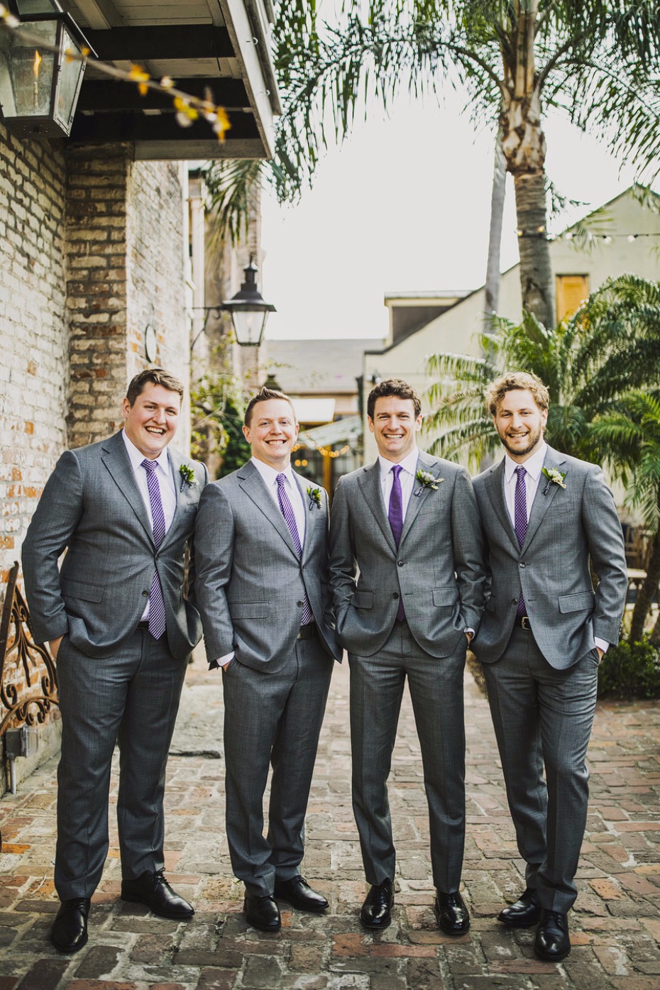 Groomsmen in grey with purple ties