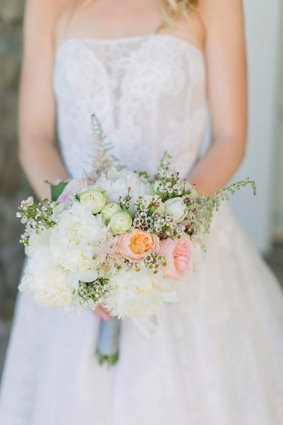 Bride holding a beautiful bouquet of flowers, elegant wedding