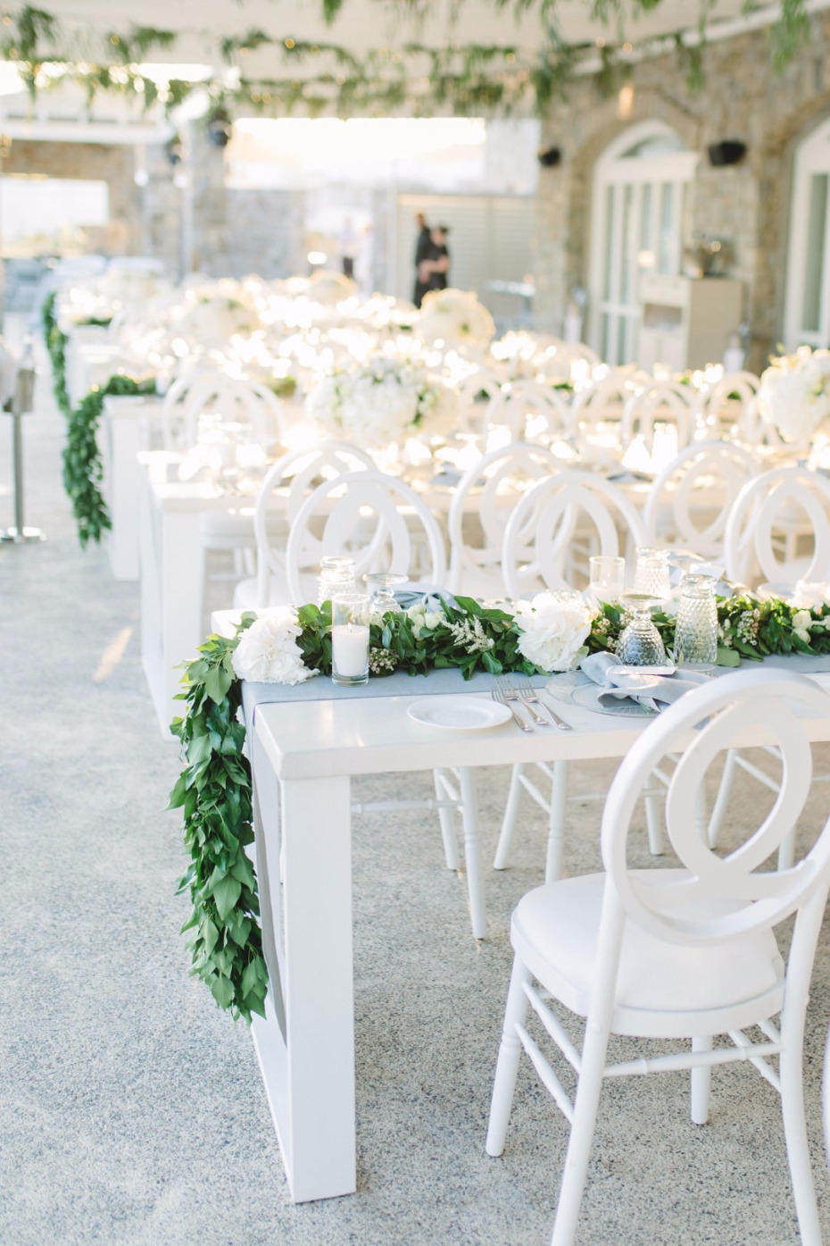 Elegant wedding reception tables with white flowers and decor