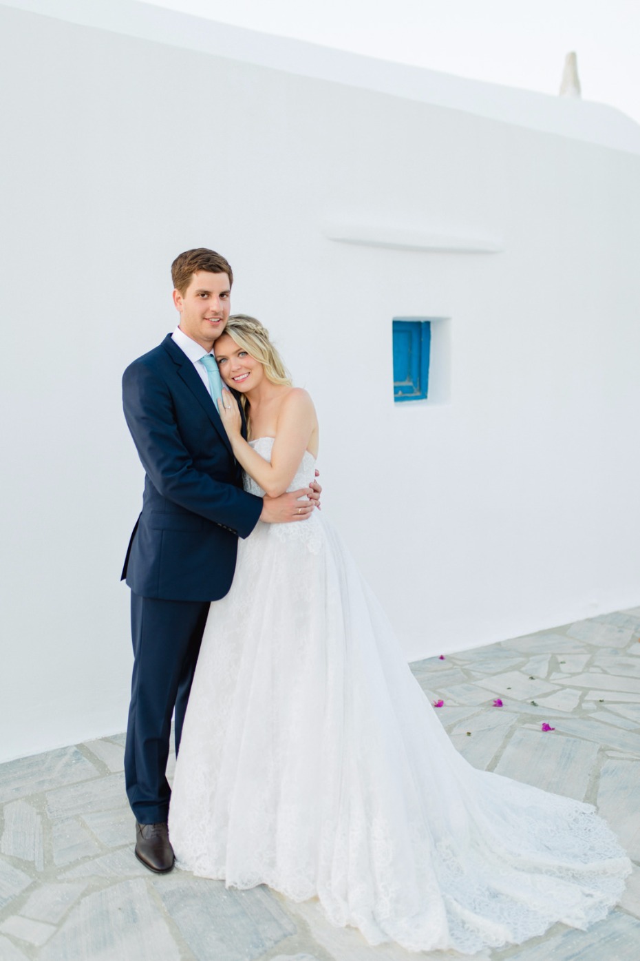 Happy couple embracing on their wedding day, posing in Greece