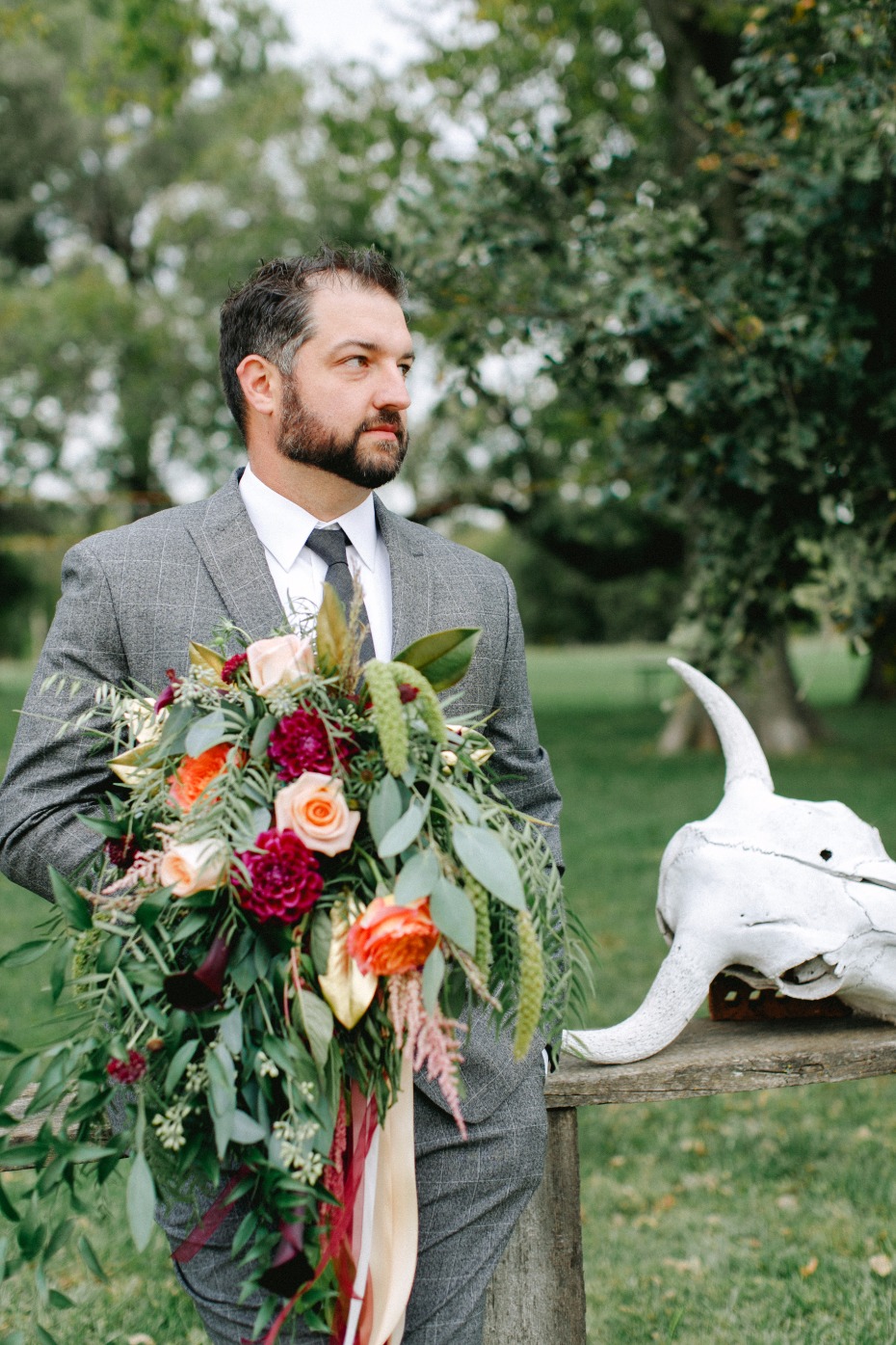groom in subtle patterned grey suit