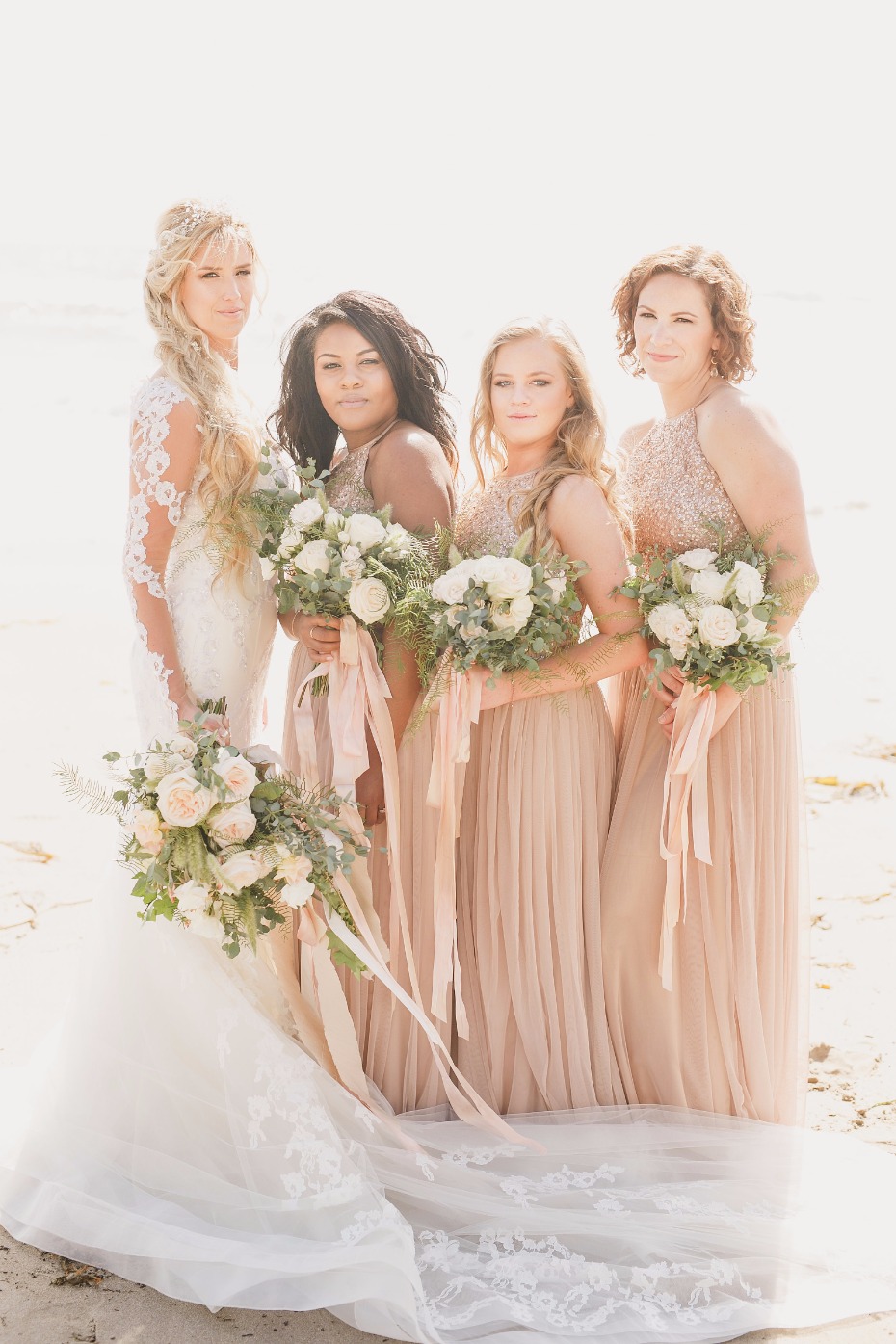 bride and bridesmaids with blush dresses