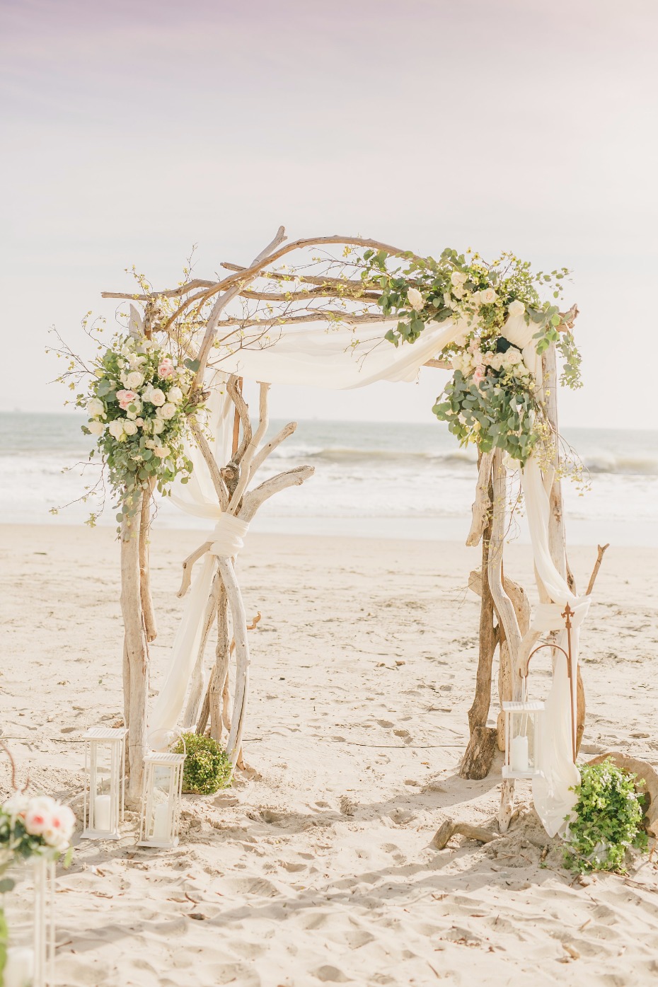 driftwood wedding arch with garden rose accents