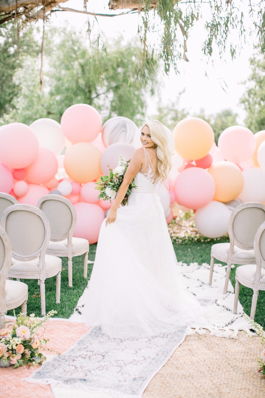 Gorgeous ceremony with balloon backdrop