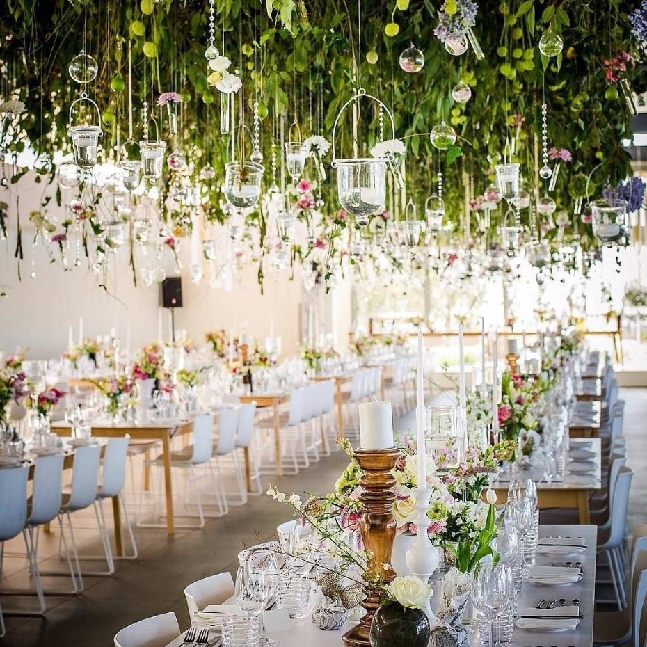 hanging floral installation with family style seating