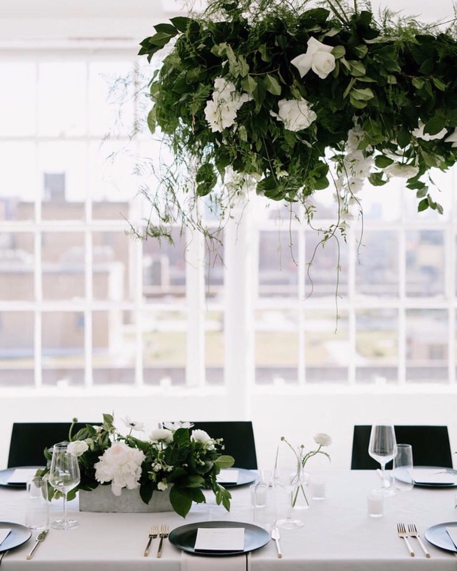 Elegant wedding table setting with hanging floral centerpiece