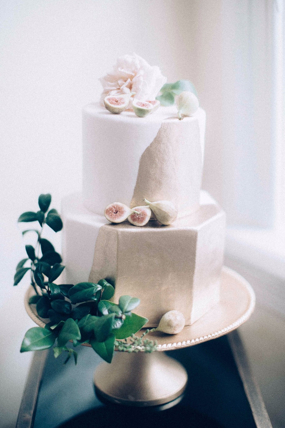 modern gold and white wedding cake