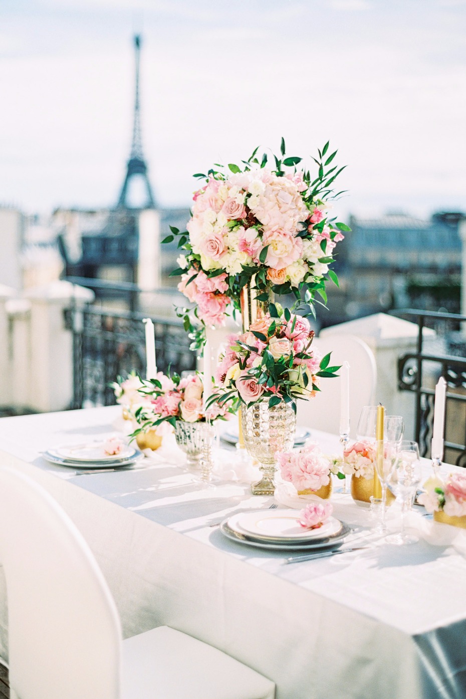 gold pink and white rooftop table setup