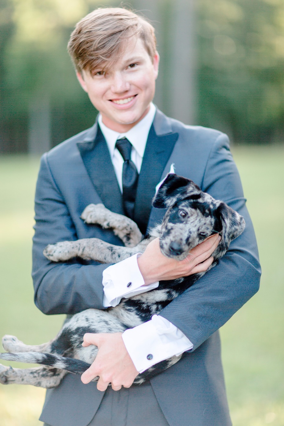 groom and his puppy