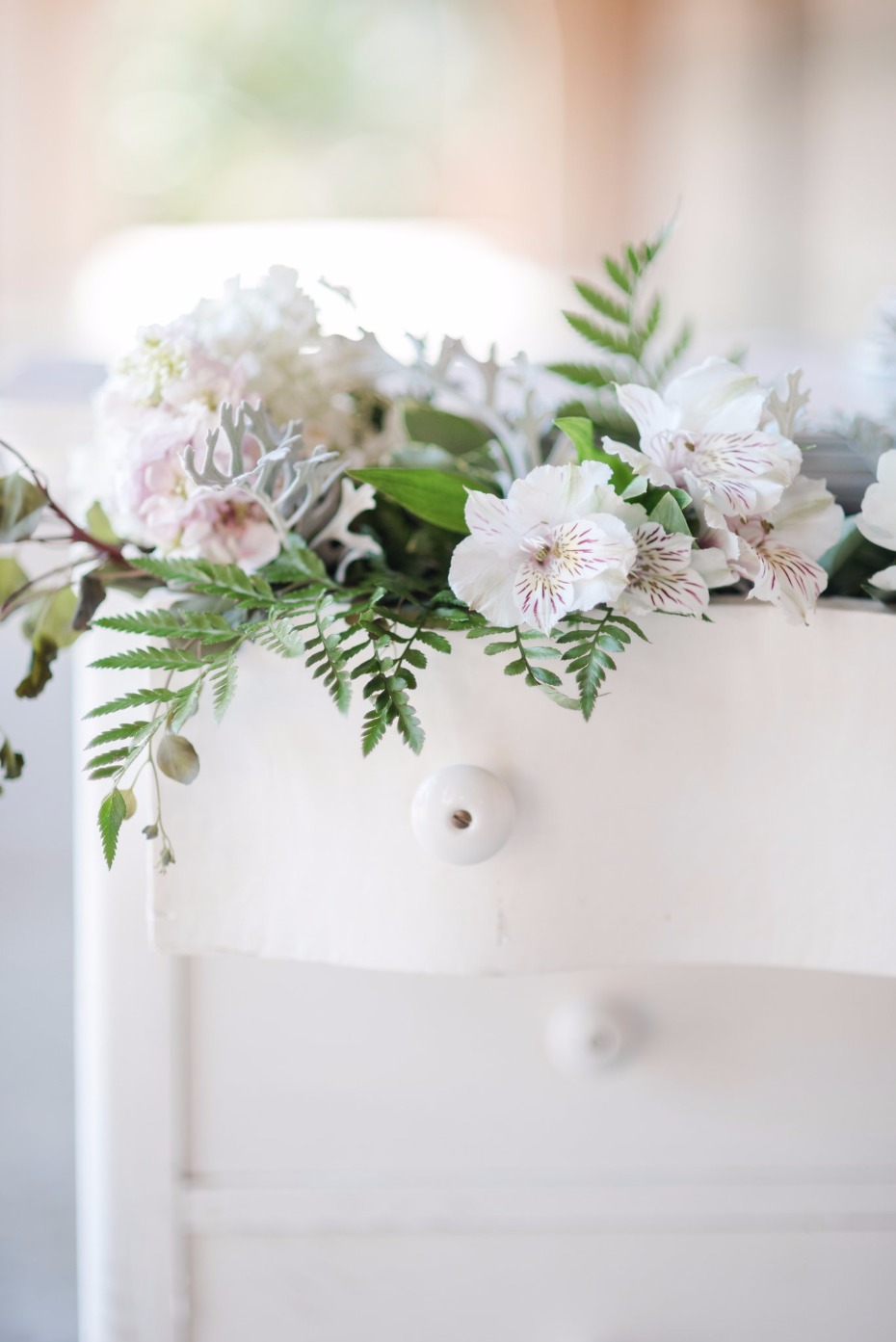 wedding dresser for your cake table filled with flowers