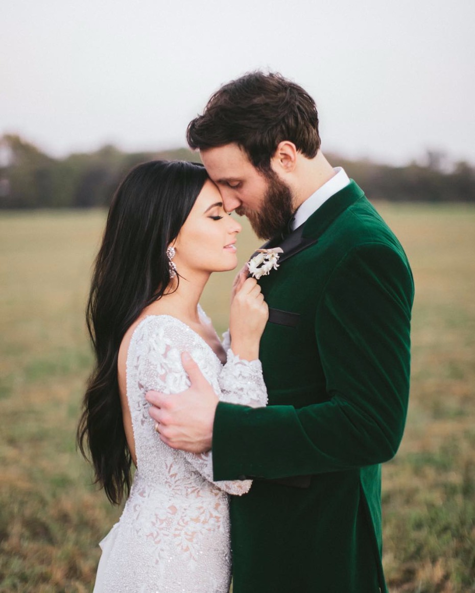 Bride and groom embrace tenderly on their wedding day