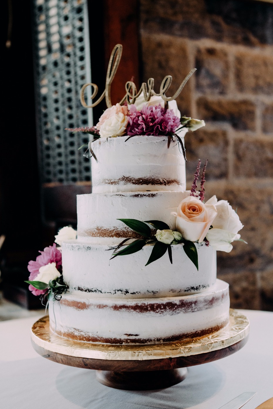 Boho chic naked cake with love topper