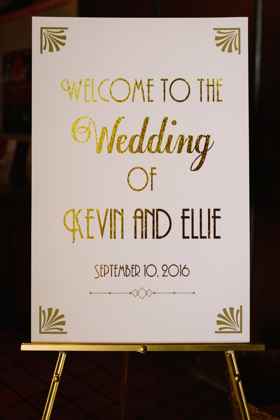 Art deco gold and white welcome sign