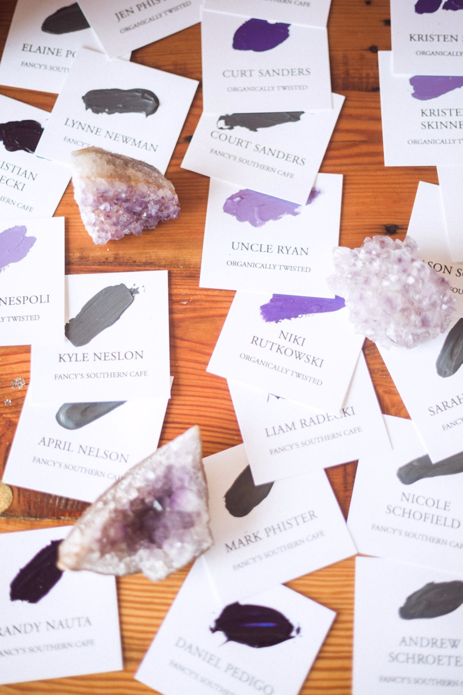 Amethyst crystals adorn place cards with paint swatches