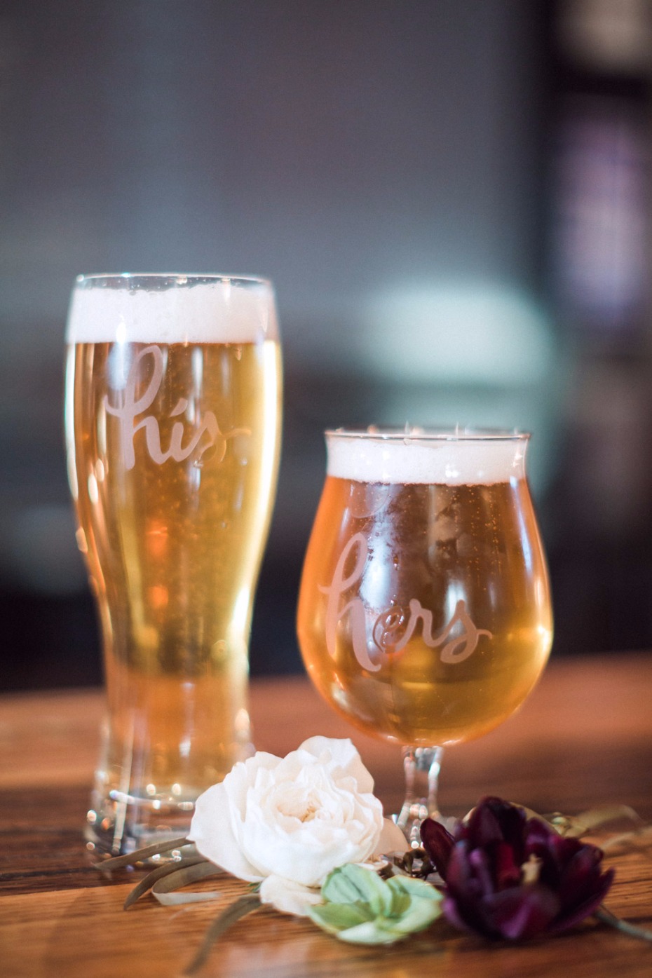 His and hers beer glasses with flowers, perfect for a celebration