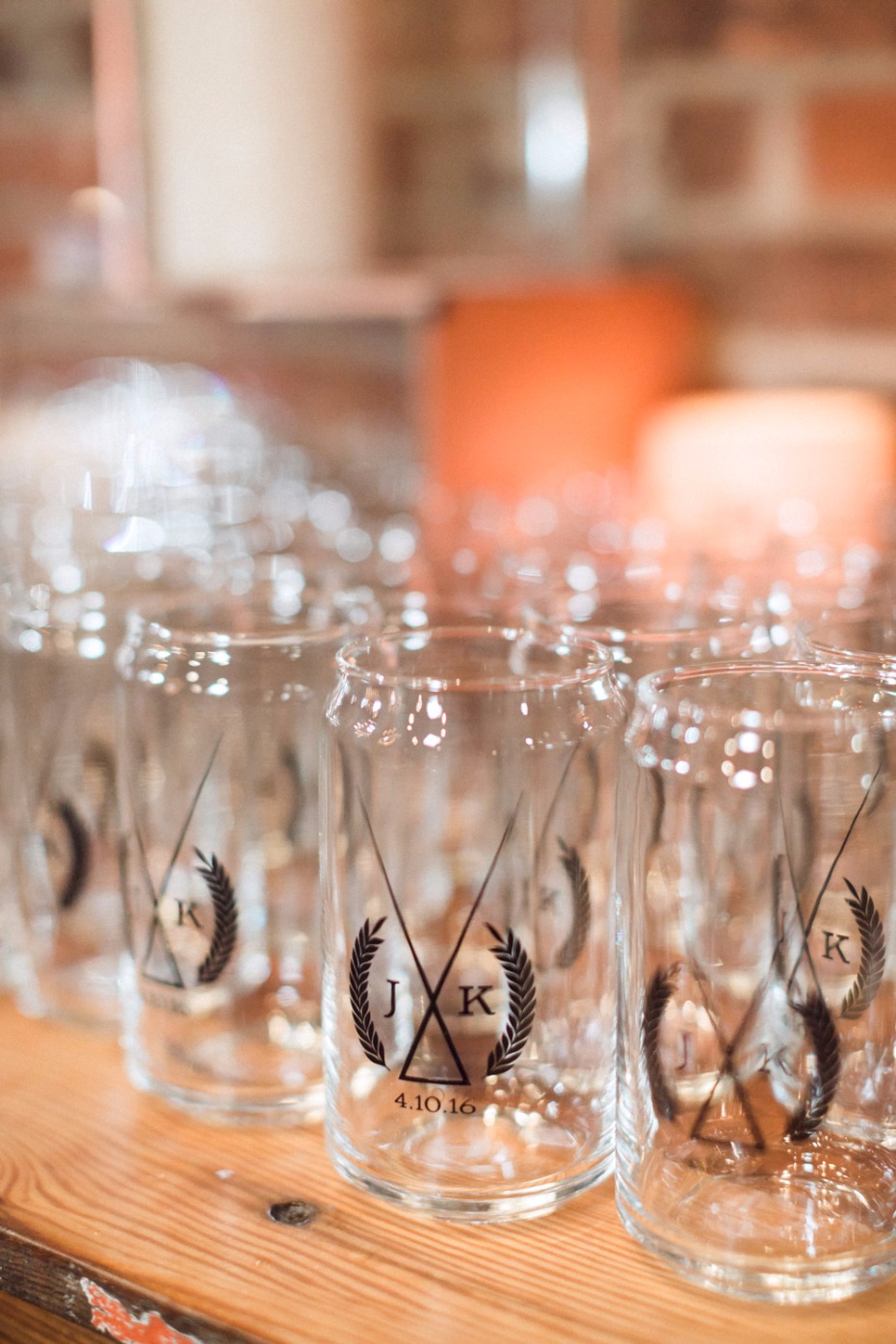 Personalized wedding glasses with initials JK and date on display